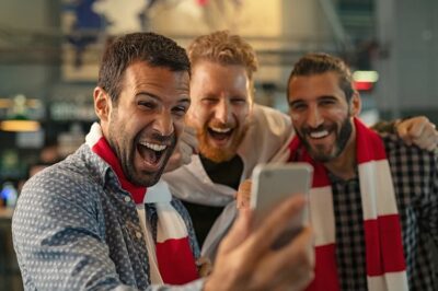 Football Fans Cheering Watching Smartphone